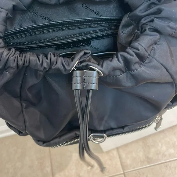 CALVIN KLEIN // black fashion backpack // fold over // TONS of zipper pockets - Picture 14 of 16
